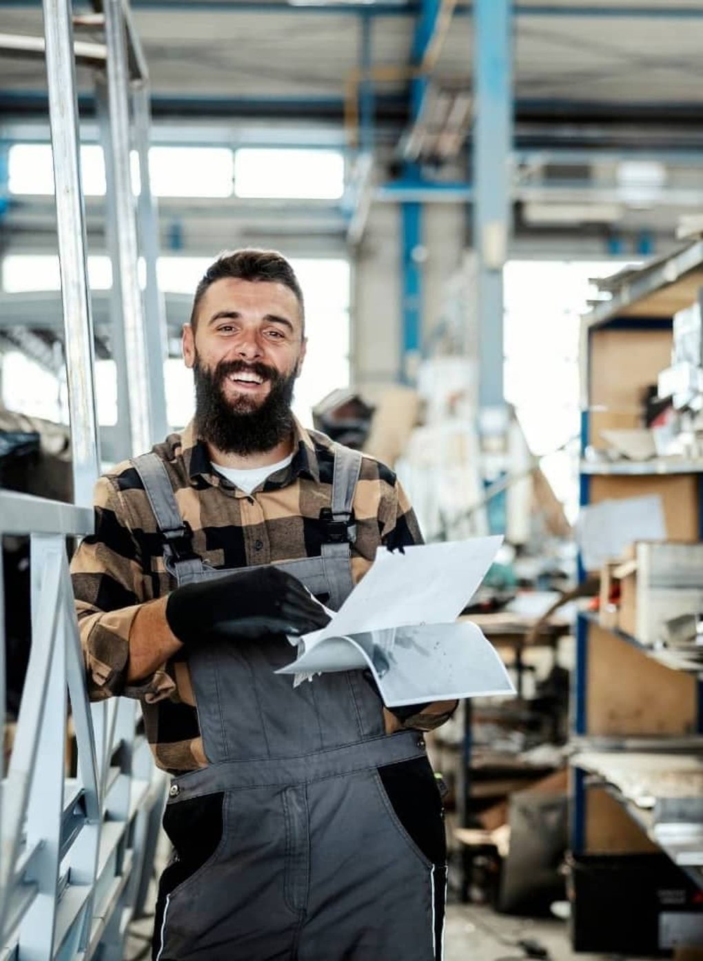 Business owner reviewing commercial finance documents in a workshop